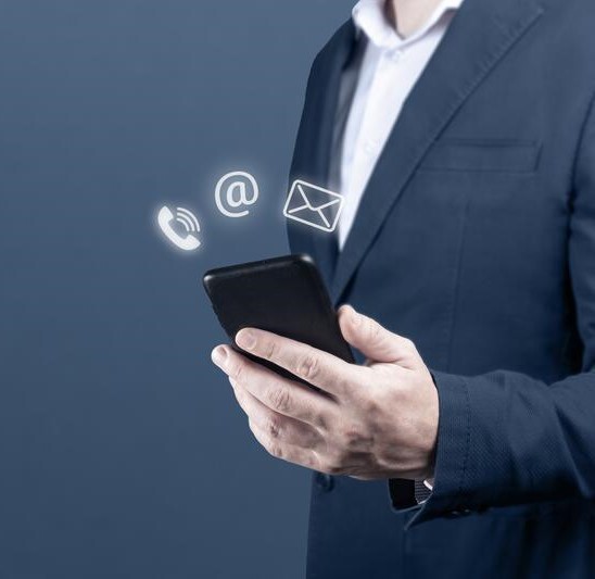 contact-us-businessman-holding-cell-phone-mail-email-icon-cutomer-support-concept-banner-blue-background-copy-space-202928760